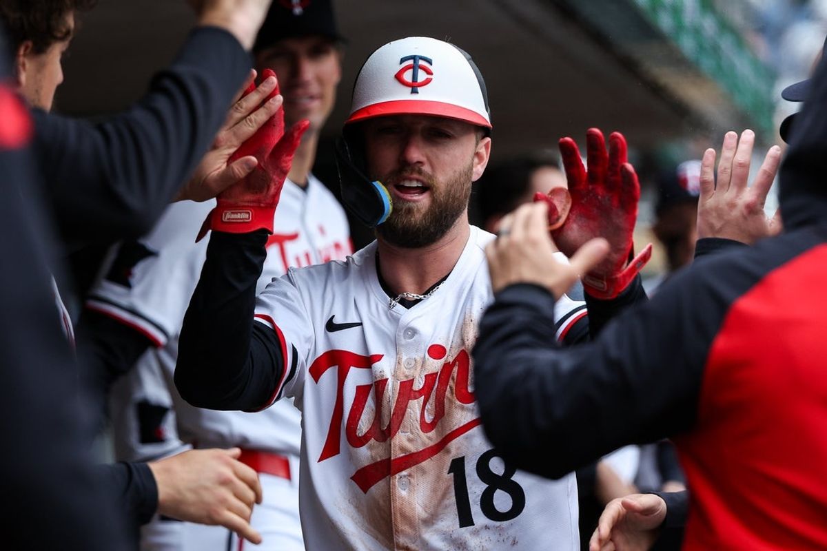 May 21, 2025; Minneapolis, Minnesota, USA; Minnesota Twins second baseman Kody Clemens (18) celebrates after scoring on a sacrifice fly hit by center fielder Harrison Bader (12) during game one of a doubleheader against the Cleveland Guardians at Target Field. Mandatory Credit: Matt Krohn-Imagn Images
