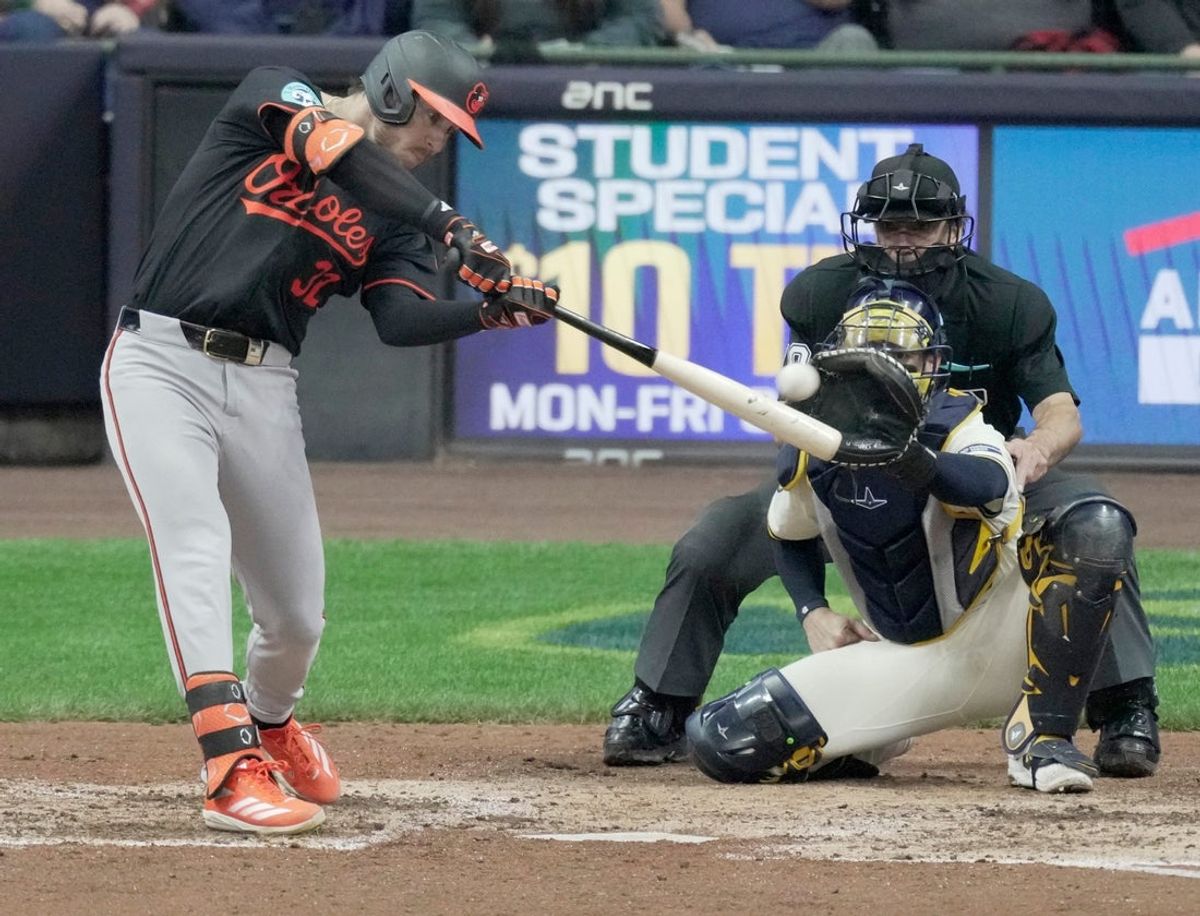 Baltimore Orioles outfielder Ryan O'Hearn (32) hits a double during the eighth inning of their game against the Milwaukee Brewers Wednesday, May 21, 2025 at American Family Field in Milwaukee, Wisconsin.