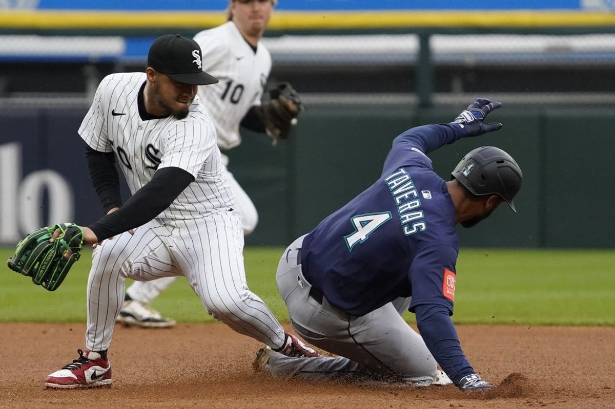 May 21, 2025; Chicago, Illinois, USA; Seattle Mariners outfielder Leody Taveras (4) steals second base as Chicago White Sox second base Lenyn Sosa (50) makes a late tag during the sixth inning at Rate Field. Mandatory Credit: David Banks-Imagn Images