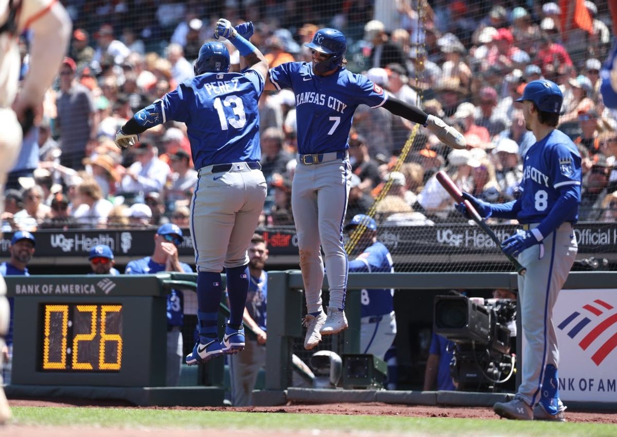 May 21, 2025; San Francisco, California, USA; Kansas City Royals catcher Salvador Perez (13) celebrates with shortstop Bobby Witt Jr. (7) after batting him in on a two-run home run against the San Francisco Giants during the fourth inning at Oracle Park. Mandatory Credit: Kelley L Cox-Imagn Images