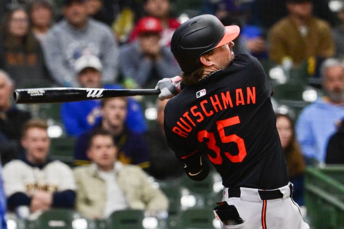 May 21, 2025; Milwaukee, Wisconsin, USA; Baltimore Orioles catcher Adley Rutschman (35) hits a 3-run home run in the eleventh inning against the Milwaukee Brewers at American Family Field. Mandatory Credit: Benny Sieu-Imagn Images