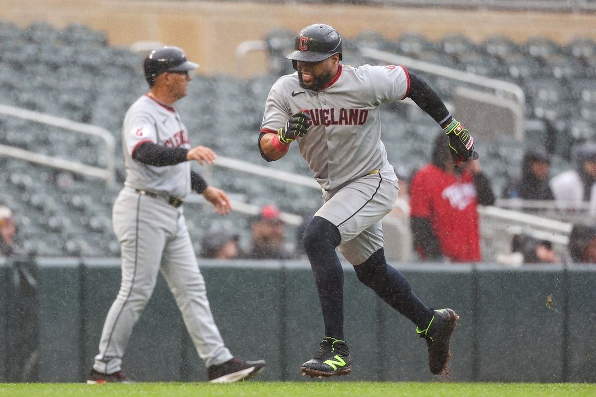 May 21, 2025; Minneapolis, Minnesota, USA; Cleveland Guardians designated hitter Carlos Santana (41) scores on a RBI sacrifice fly hit by right fielder Nolan Jones (22) in the sixth inning during game two of a doubleheader against the Minnesota Twins at Target Field. Mandatory Credit: Matt Krohn-Imagn Images