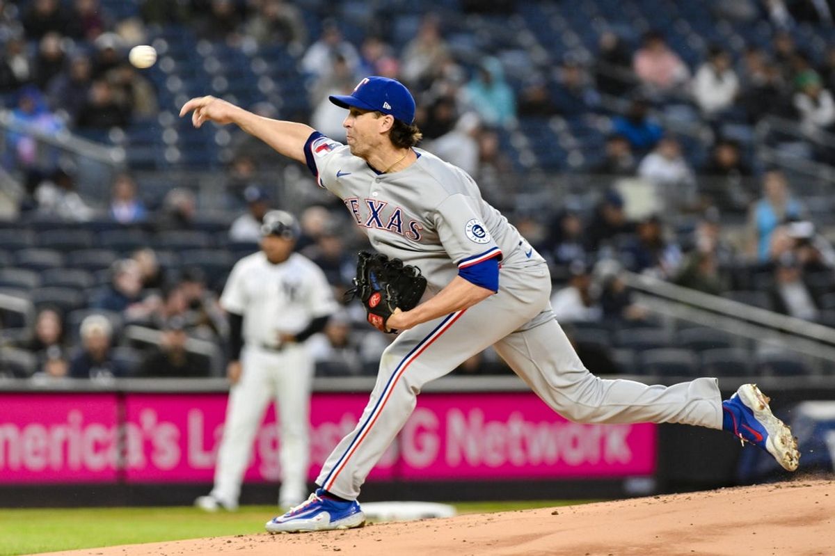 May 21, 2025; Bronx, New York, USA; Texas Rangers pitcher Jacob deGrom (48) pitches against the New York Yankees during the first inning at Yankee Stadium. Mandatory Credit: John Jones-Imagn Images