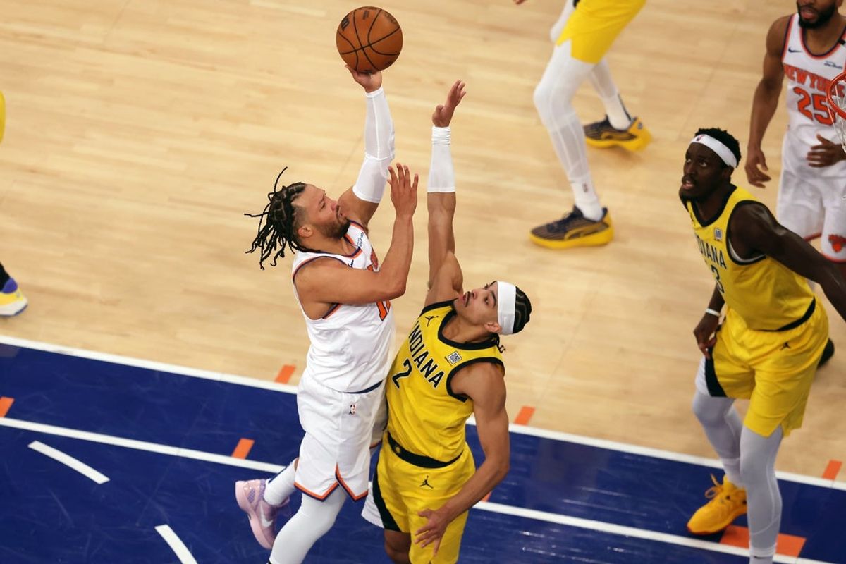 May 21, 2025; New York, New York, USA; New York Knicks guard Jalen Brunson (11) shoots against Indiana Pacers guard Andrew Nembhard (2) in the first quarter during game one of the eastern conference finals for the 2025 NBA Playoffs at Madison Square Garden. Mandatory Credit: Brad Penner-Imagn Images