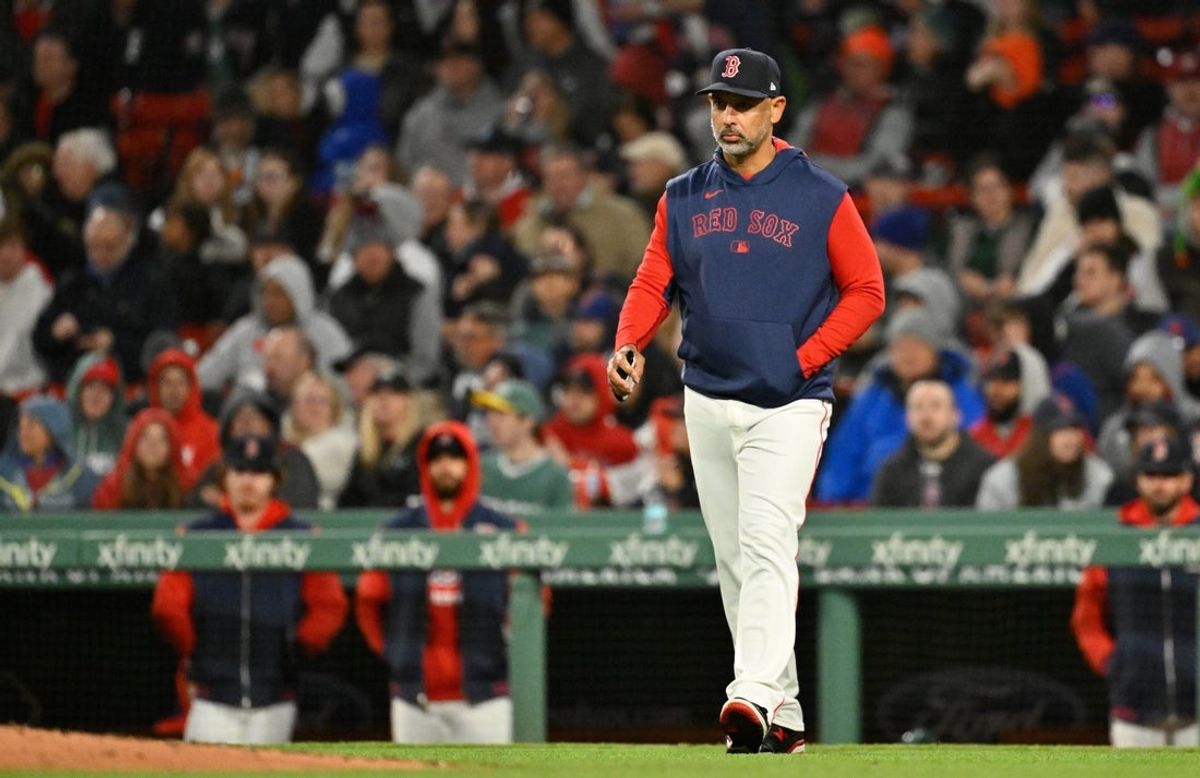 May 21, 2025; Boston, Massachusetts, USA; Boston Red Sox manager Alex Cora (13) walks to the mound during the sixth inning against the New York Mets at Fenway Park. Mandatory Credit: Eric Canha-Imagn Images