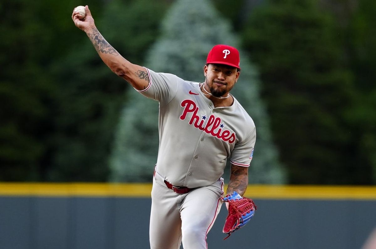 May 21, 2025; Denver, Colorado, USA; Philadelphia Phillies starting pitcher Taijuan Walker (99) delivers a pitch in the first inning against the Colorado Rockies at Coors Field. Mandatory Credit: Ron Chenoy-Imagn Images