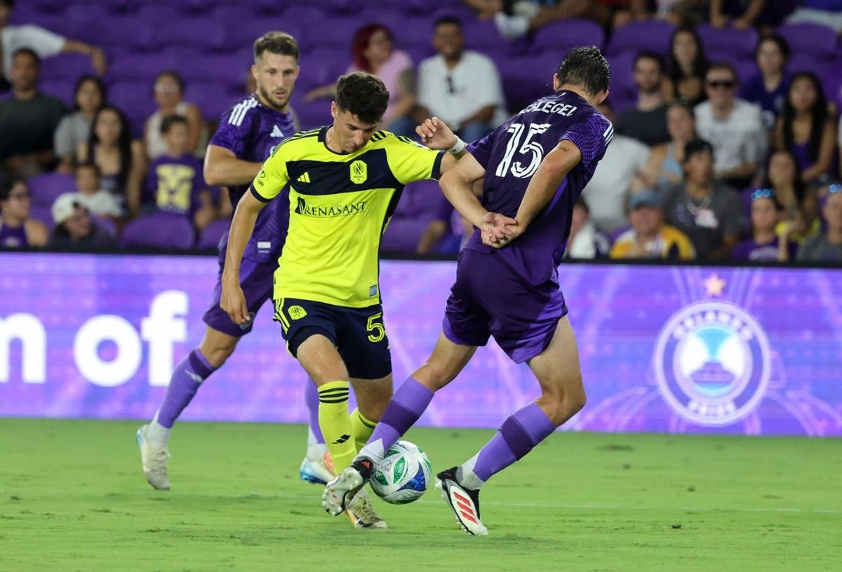 May 21, 2025; Orlando, Florida, USA;Orlando City defender Rodrigo Schlegel (15) defends Nashville SC midfielder Ethan O'Brien (55) during the second half at Inter&Co Stadium. Mandatory Credit: Kim Klement Neitzel-Imagn Images