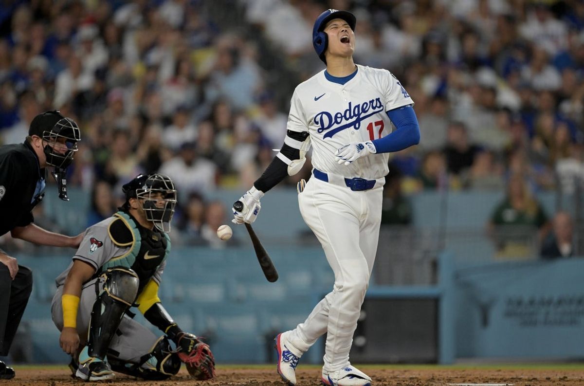 May 21, 2025; Los Angeles, California, USA; Los Angeles Dodgers designated hitter Shohei Ohtani (17) reacts after fouling the ball off his foot during the fourth inning against the Arizona Diamondbacks at Dodger Stadium. Mandatory Credit: Jayne Kamin-Oncea-Imagn Images