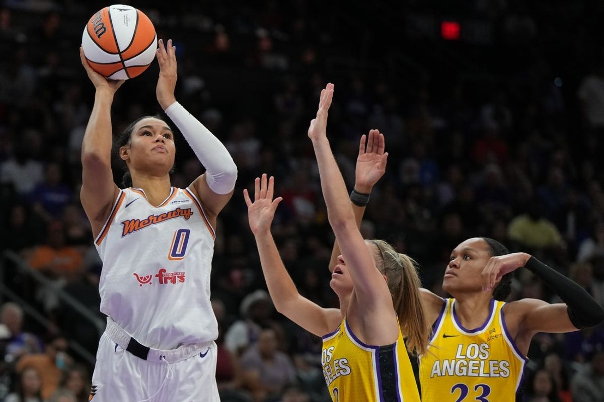 May 21, 2025; Phoenix, Arizona, USA; Phoenix Mercury forward Satou Sabally (0) shoots over Los Angeles Sparks forward Rickea Jackson (2) and forward Azura Stevens (23) in the second half at Footprint Center. Mandatory Credit: Rick Scuteri-Imagn Images