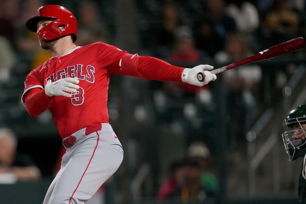 May 21, 2025; West Sacramento, California, USA; Los Angeles Angels left fielder Taylor Ward (3) hits a RBI single against the Athletics in the ninth inning at Sutter Health Park. Mandatory Credit: Cary Edmondson-Imagn Images
