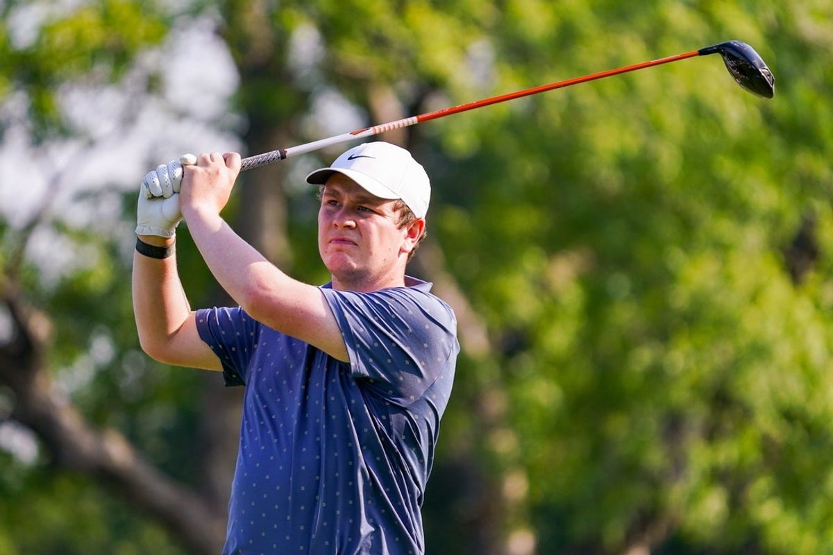 May 22, 2025; Fort Worth, Texas, USA; Robert MacIntyre watches his shot from the 14th tee during the first round of the Charles Schwab Challenge golf tournament. Mandatory Credit: Raymond Carlin III-Imagn Images