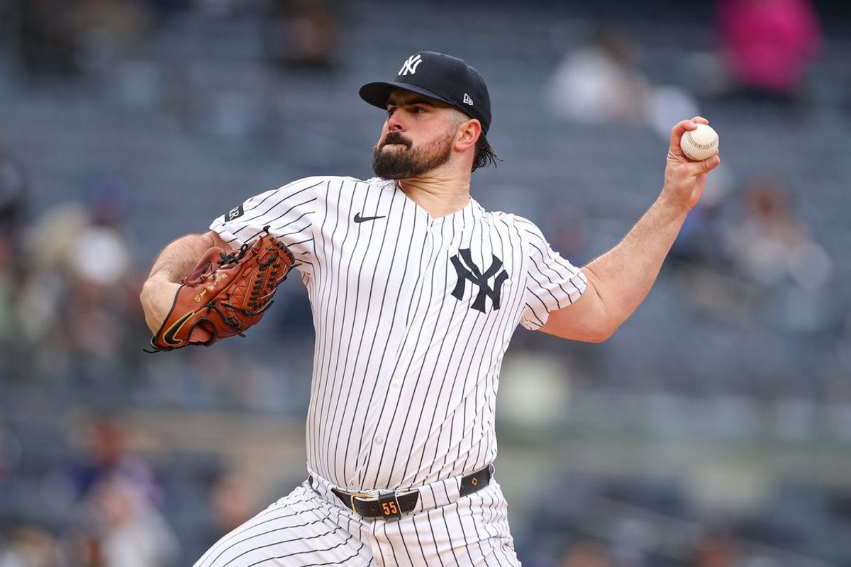 May 22, 2025; Bronx, New York, USA; New York Yankees starting pitcher Carlos Rodon (55) delivers a pitch during the first inning against the Texas Rangers at Yankee Stadium. Mandatory Credit: Vincent Carchietta-Imagn Images