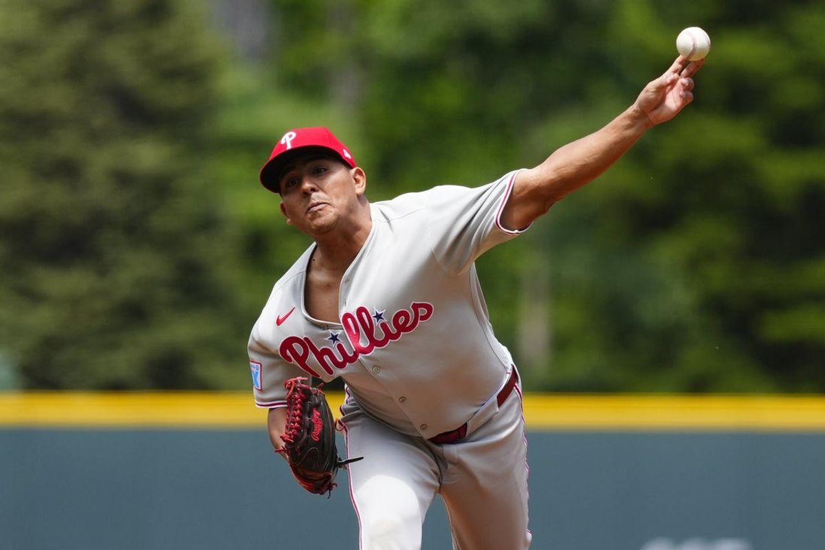 May 22, 2025; Denver, Colorado, USA; Philadelphia Phillies starting pitcher Ranger Suarez (55) delivers a pitch in the first inning against the Colorado Rockies at Coors Field. Mandatory Credit: Ron Chenoy-Imagn Images