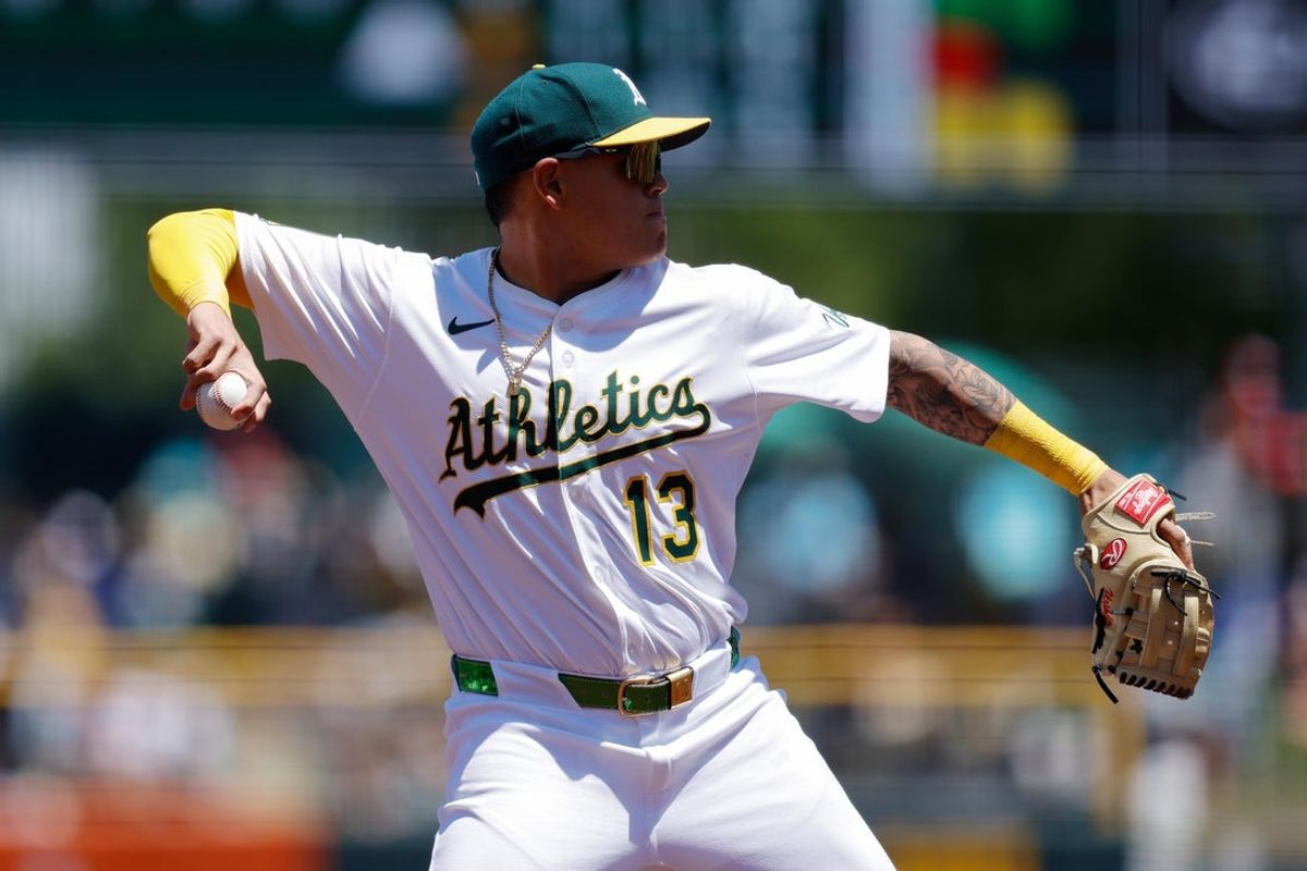 May 22, 2025; West Sacramento, California, USA; Athletics third baseman Gio Urshela (13) throws to first base for an out during the third inning against the Los Angeles Angels at Sutter Health Park. Mandatory Credit: Sergio Estrada-Imagn Images