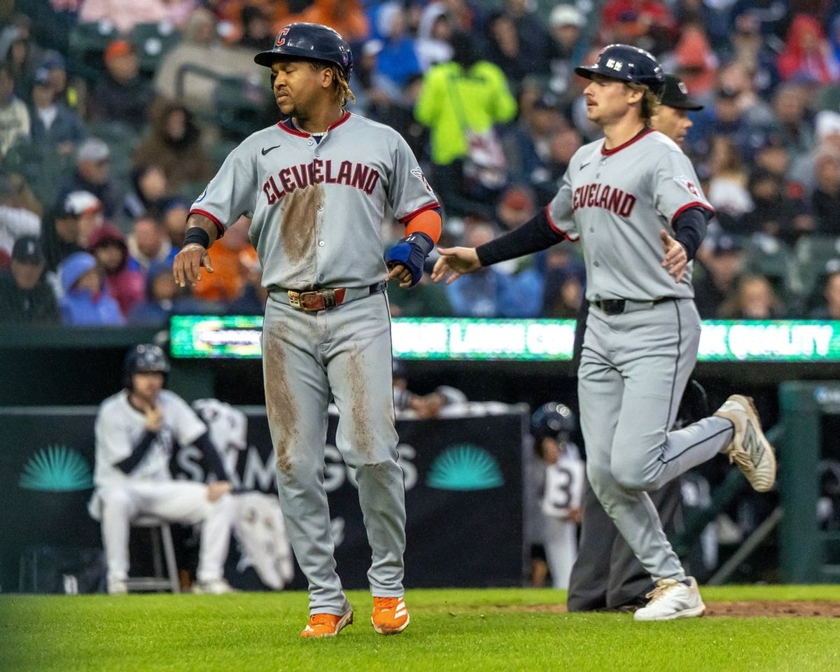 May 22, 2025; Detroit, Michigan, USA; Cleveland Guardians third base José Ramírez (11) and first base Kyle Manzardo (9) score on a double hit by first base Carlos Santana (41) in the fourth inning against the Detroit Tigers at Comerica Park. Mandatory Credit: David Reginek-Imagn Images