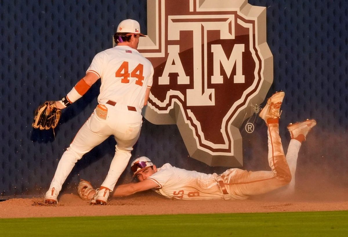 May 22, 2025; Hoover, AL, USA; Texas outfielder Max Belyeu (44) and Texas centerfielder Will Gasparino make a desperate attempt to corral a double by Tennessee shortstop Gavin Kilen (6) that drove in the winning runs in the third round of the SEC Baseball Tournament at the Hoover Met. Tennessee eliminated Texas with a 12-inning 7-5 victory.