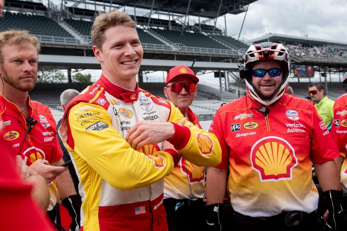 Team Penske driver Josef Newgarden (2) laughs with his crew Friday, May 23, 2025, on Carb Day ahead of the 109th running of the Indianapolis 500 at Indianapolis Motor Speedway.