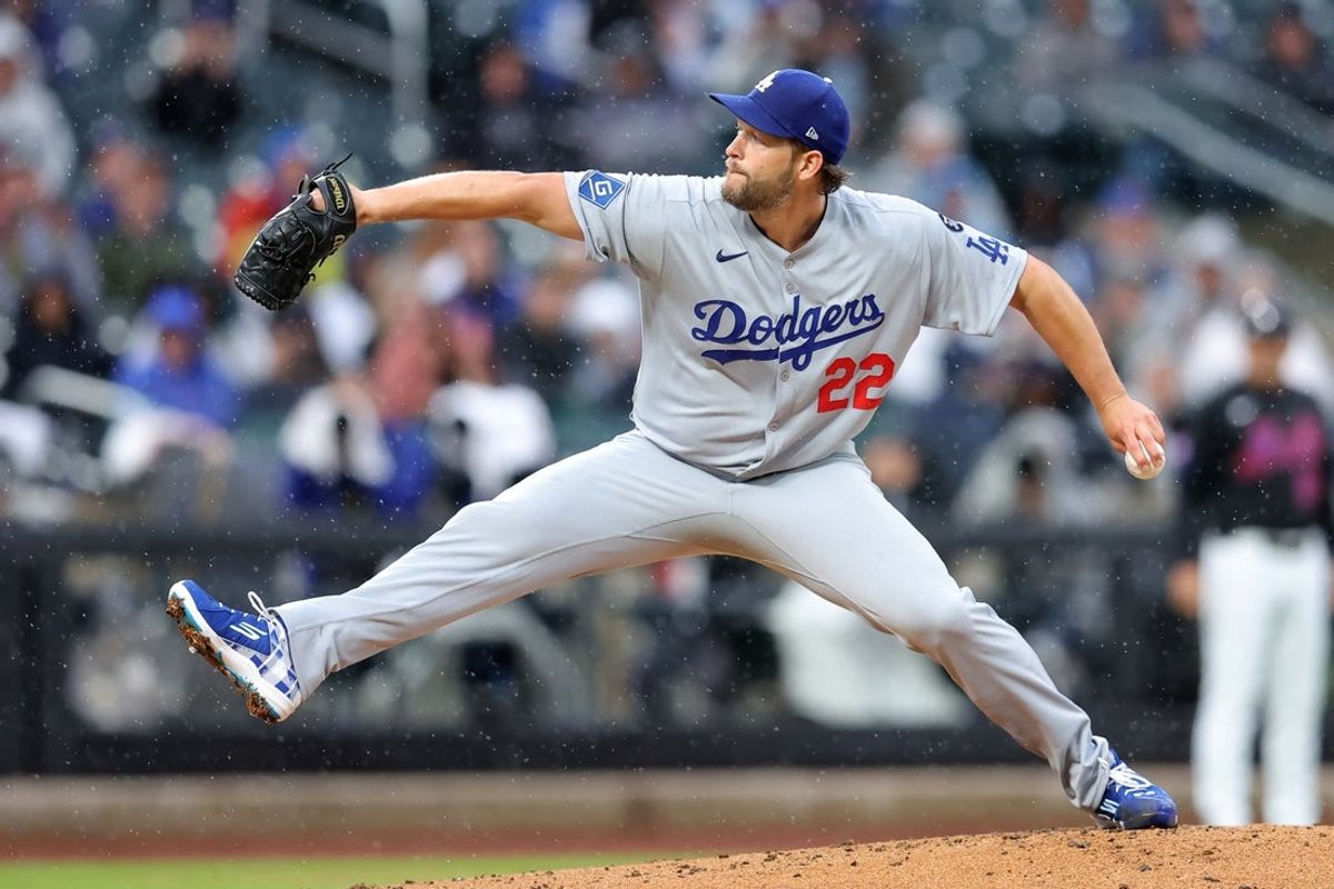 May 23, 2025; New York City, New York, USA; Los Angeles Dodgers starting pitcher Clayton Kershaw (22) pitches against the New York Mets during the first inning at Citi Field. Mandatory Credit: Brad Penner-Imagn Images