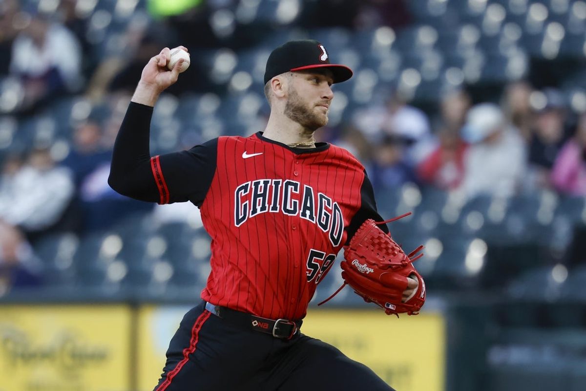 May 23, 2025; Chicago, Illinois, USA; Chicago White Sox starting pitcher Sean Burke (59) delivers a pitch against the Texas Rangers during the first inning at Rate Field. Mandatory Credit: Kamil Krzaczynski-Imagn Images