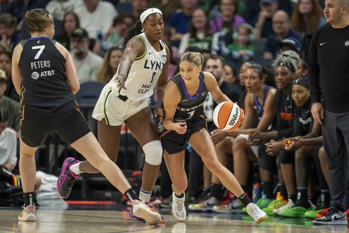 May 23, 2025; Minneapolis, Minnesota, USA; Connecticut Sun guard Jacy Sheldon (4) dribbles the ball around Minnesota Lynx forward Diamond Miller (1) as a screen is set from Connecticut Sun forward Haley Peters (7) in the first half at Target Center. Mandatory Credit: Jesse Johnson-Imagn Images
