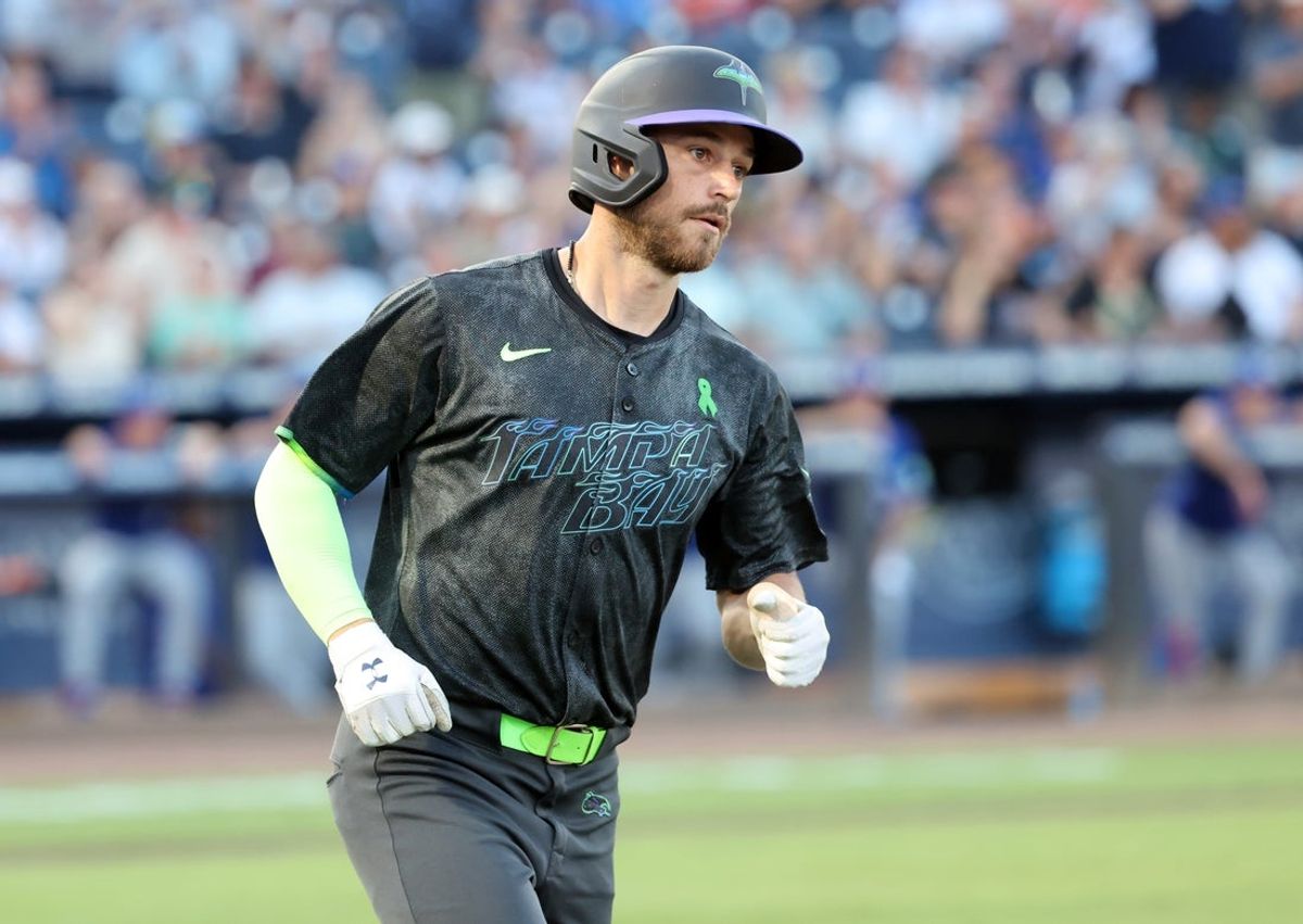 May 23, 2025; St. Petersburg, Florida, USA;  Tampa Bay Rays second base Brandon Lowe (8) hits a home run during the third inning against the Toronto Blue Jays at George M. Steinbrenner Field. Mandatory Credit: Kim Klement Neitzel-Imagn Images