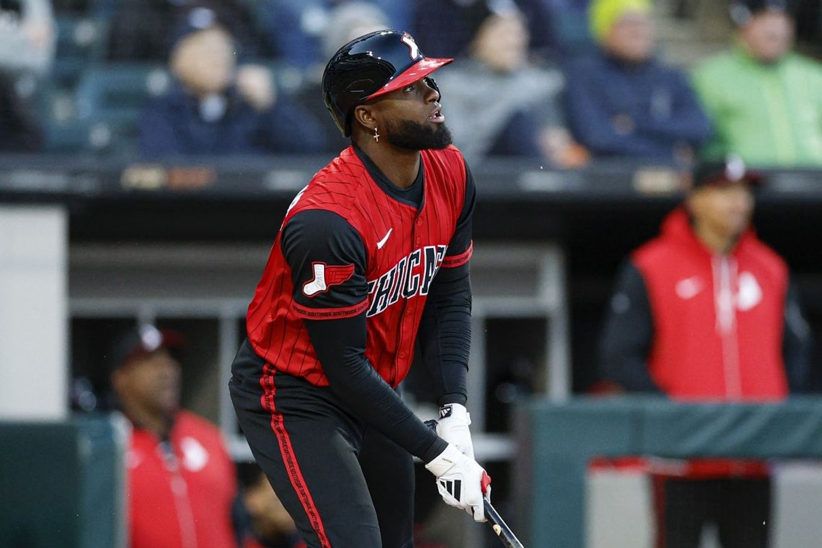 May 23, 2025; Chicago, Illinois, USA; Chicago White Sox center fielder Luis Robert Jr. (88) hits an RBI-single against the Texas Rangers during the third inning at Rate Field. Mandatory Credit: Kamil Krzaczynski-Imagn Images