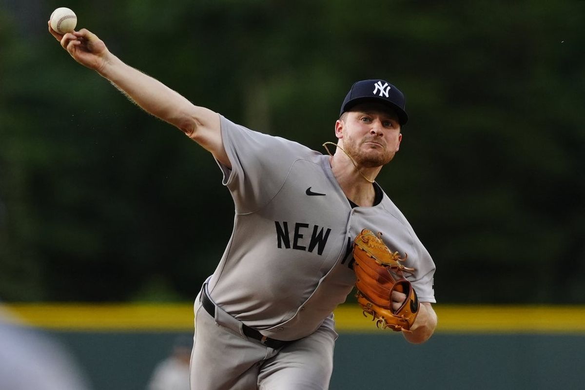May 23, 2025; Denver, Colorado, USA; New York Yankees starting pitcher Clarke Schmidt (36) delivers a pitch in the first inning against the Colorado Rockies at Coors Field. Mandatory Credit: Ron Chenoy-Imagn Images