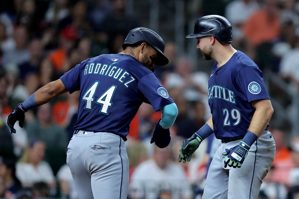 May 23, 2025; Houston, Texas, USA; Seattle Mariners catcher Cal Raleigh (29) is congratulated by Seattle Mariners center fielder Julio Rodríguez (44) after hitting a two-run home run against the Houston Astros during the seventh inning at Daikin Park. Mandatory Credit: Erik Williams-Imagn Images