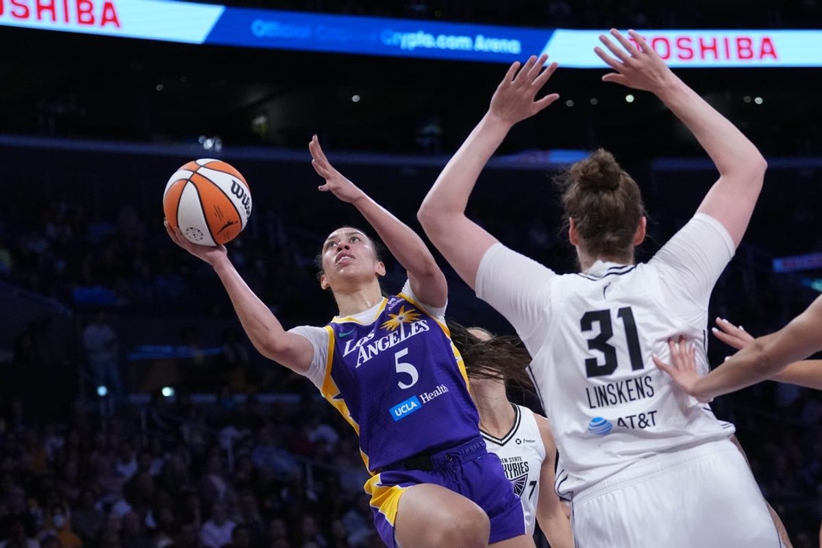 May 23, 2025; Los Angeles, California, USA; LA Sparks forward Dearica Hamby (5) shoots the ball against Golden State Valkyries center Kyara Linskens (31) in the first half at Crypto.com Arena. Mandatory Credit: Kirby Lee-Imagn Images