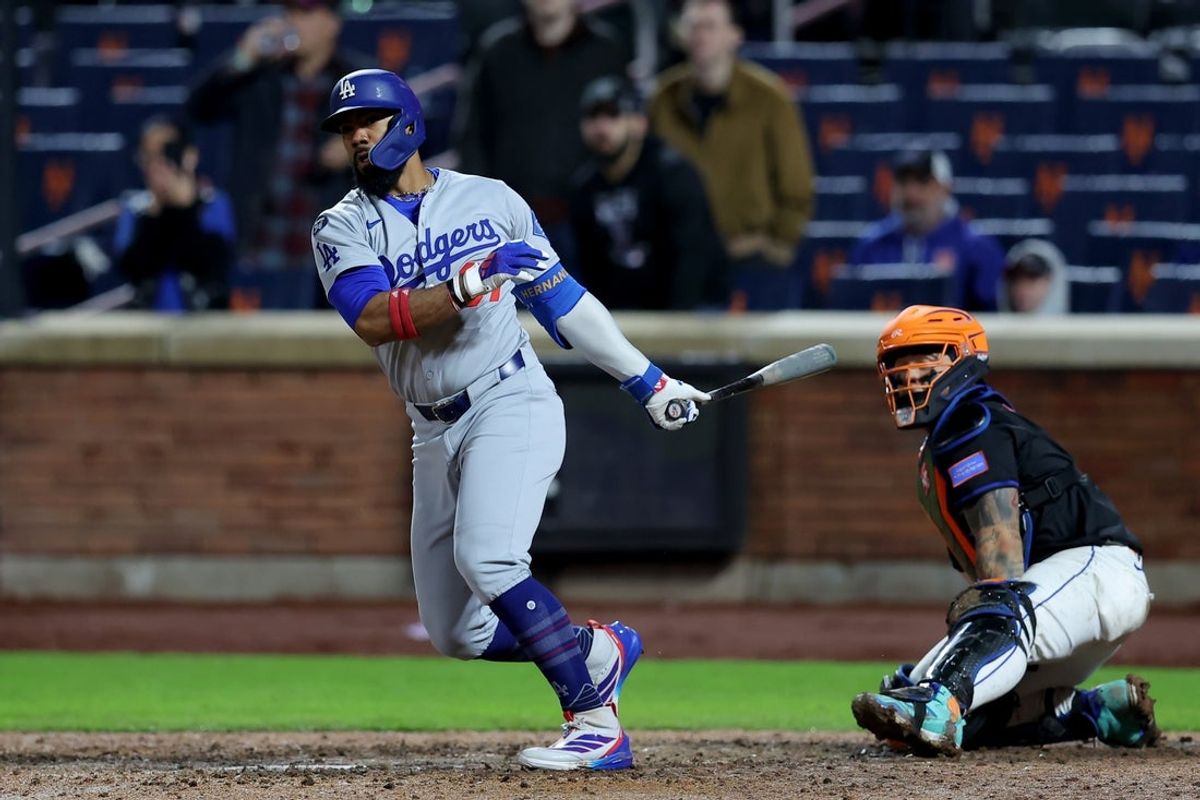 May 23, 2025; New York City, New York, USA; Los Angeles Dodgers right fielder Teoscar Hernandez (37) follows through on an RBI single against the New York Mets during the thirteenth inning at Citi Field. Mandatory Credit: Brad Penner-Imagn Images
