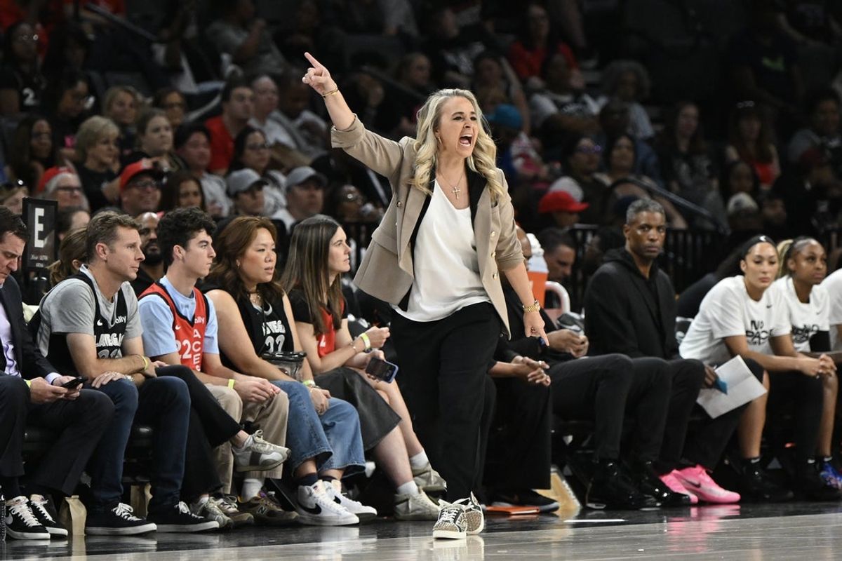 May 23, 2025; Las Vegas, Nevada, USA; Las Vegas Aces head coach Becky Hammon gestures to players in the first quarter of the game against the Washington Mystics at Michelob Ultra Arena. Mandatory Credit: Candice Ward-Imagn Images