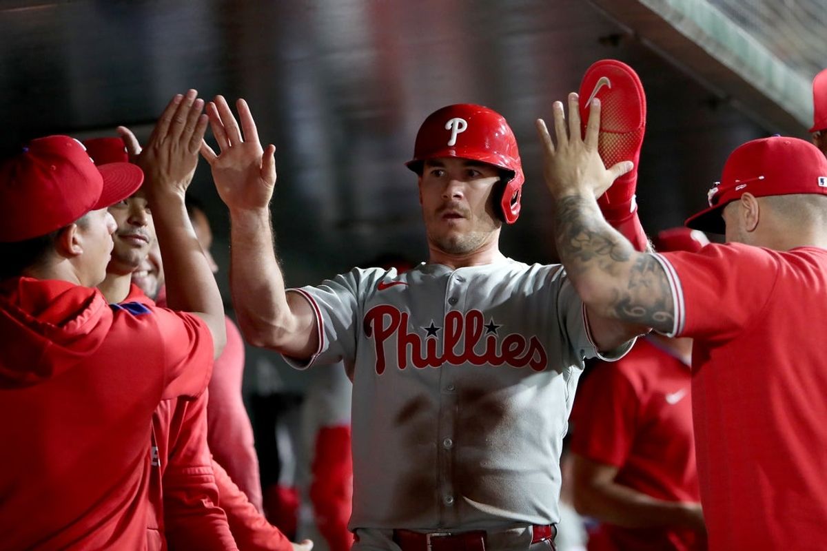 May 23, 2025; West Sacramento, California, USA; Philadelphia Phillies catcher J.T. Realmuto (10) is congratulated by teammates after scoring a run against the Athletics during the ninth inning at Sutter Health Park. Mandatory Credit: Dennis Lee-Imagn Images