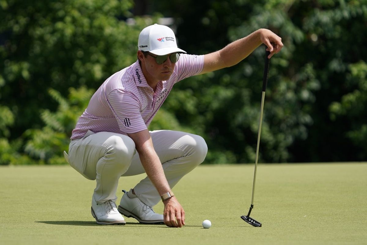May 24, 2025; Fort Worth, Texas, USA; Ben Griffin prepares to putt on the 11th green during the third round of the Charles Schwab Challenge golf tournament. Mandatory Credit: Raymond Carlin III-Imagn Images