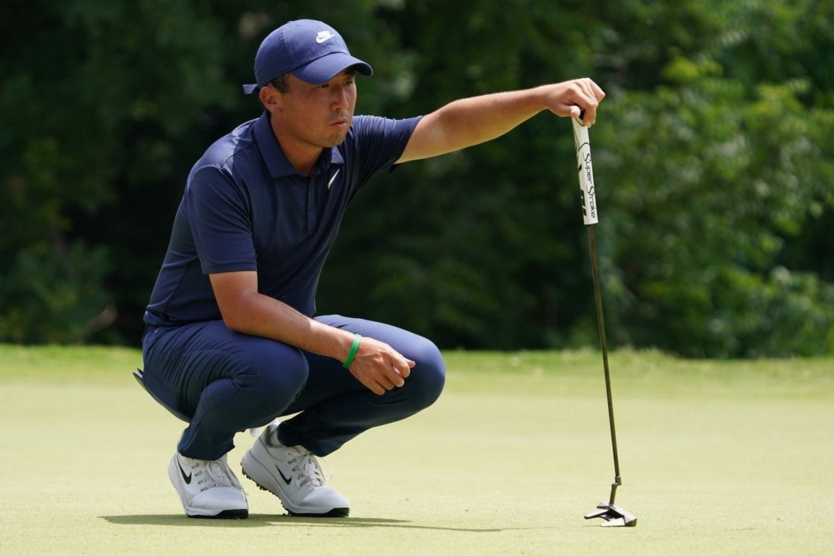 May 24, 2025; Fort Worth, Texas, USA; Doug Ghim waits to putt on the 11th green during the third round of the Charles Schwab Challenge golf tournament. Mandatory Credit: Raymond Carlin III-Imagn Images