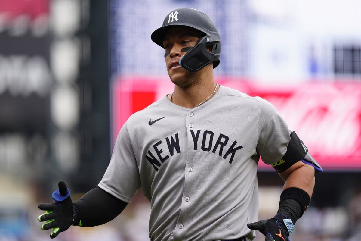 May 24, 2025; Denver, Colorado, USA; New York Yankees right fielder Aaron Judge (99) runs off a solo home run in the first inning against the Colorado Rockies at Coors Field. Mandatory Credit: Ron Chenoy-Imagn Images