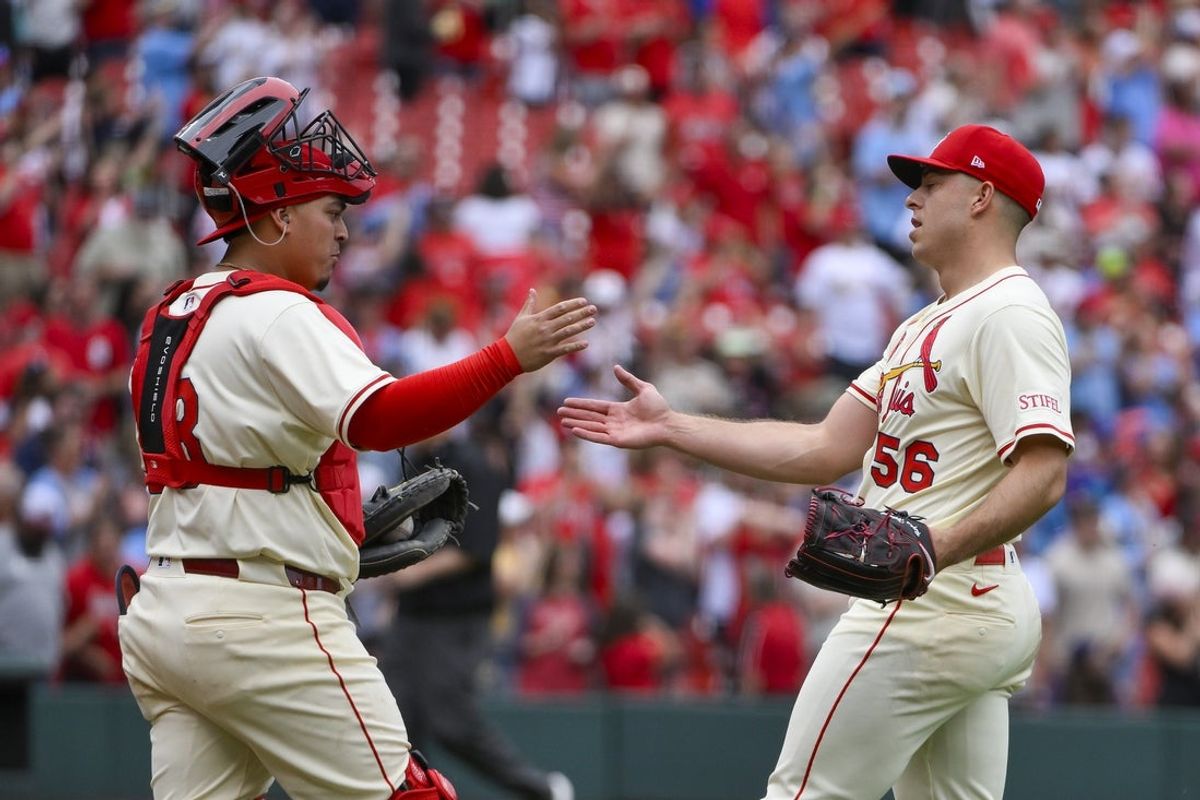 May 24, 2025; St. Louis, Missouri, USA;  St. Louis Cardinals relief pitcher Ryan Helsley (56) celebrates with catcher Yohel Pozo (63) after the Cardinals defeated the Arizona Diamondbacks at Busch Stadium. Mandatory Credit: Jeff Curry-Imagn Images