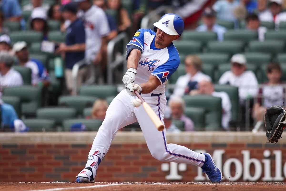 May 24, 2025; Atlanta, Georgia, USA; Atlanta Braves catcher Drake Baldwin (30) hits a single against the San Diego Padres in the third inning at Truist Park. Mandatory Credit: Brett Davis-Imagn Images