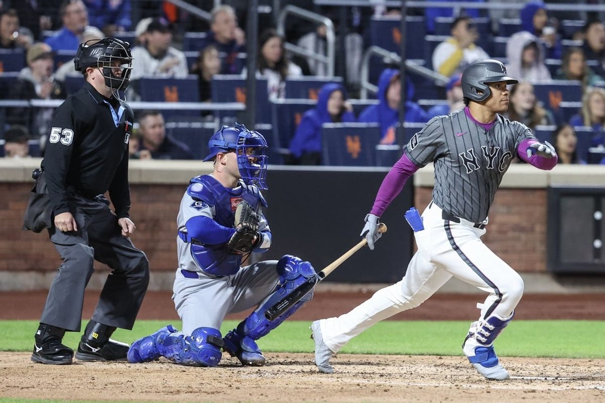 May 24, 2025; New York City, New York, USA;  New York Mets right fielder Juan Soto (22) hits a two run double in the fourth inning against the Los Angeles Dodgers at Citi Field. Mandatory Credit: Wendell Cruz-Imagn Images