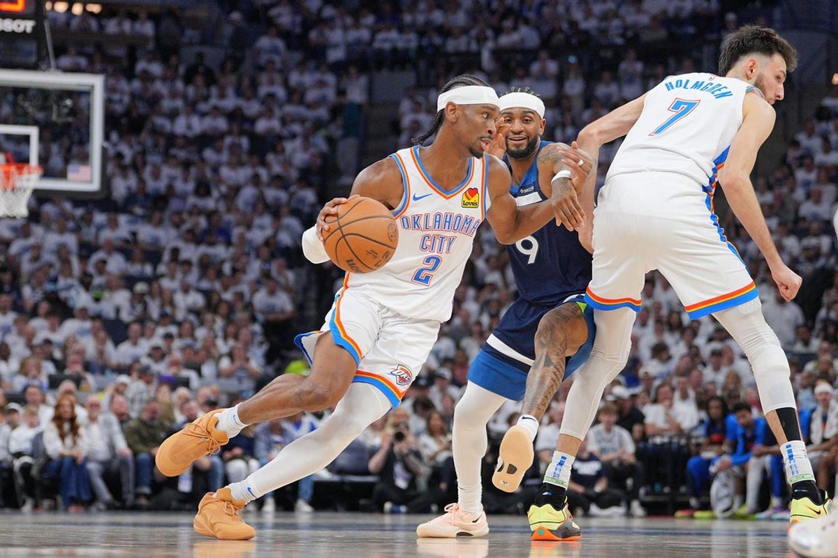 May 24, 2025; Minneapolis, Minnesota, USA; Oklahoma City Thunder guard Shai Gilgeous-Alexander (2) dribbles the ball against the Minnesota Timberwolves during the first half in game three of the western conference finals for the 2025 NBA Playoffs at Target Center. Mandatory Credit: Brad Rempel-Imagn Images