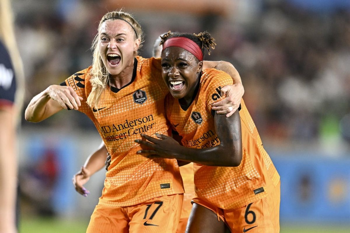 May 24, 2025; Houston, Texas, USA; Houston Dash forward Messiah Bright (6) celebrates after scoring a goal with midfielder Sarah Puntigam (17) during the second half at Shell Energy Stadium. Mandatory Credit: Maria Lysaker-Imagn Images