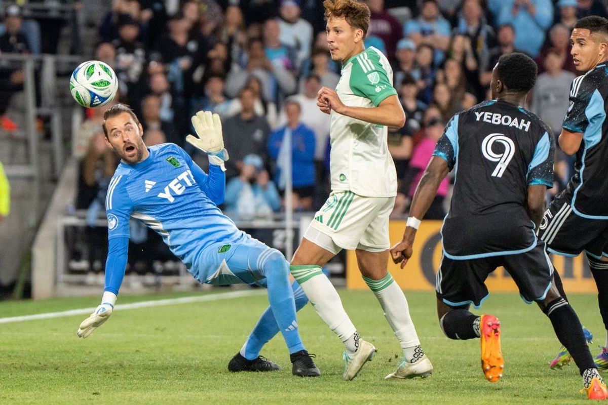 May 24, 2025; Saint Paul, Minnesota, USA; Austin FC goalkeeper Brad Stuver (1) watches a rebound head toward Minnesota United forward Kelvin Yeboah (9) in the second half at Allianz Field. Mandatory Credit: Matt Blewett-Imagn Images