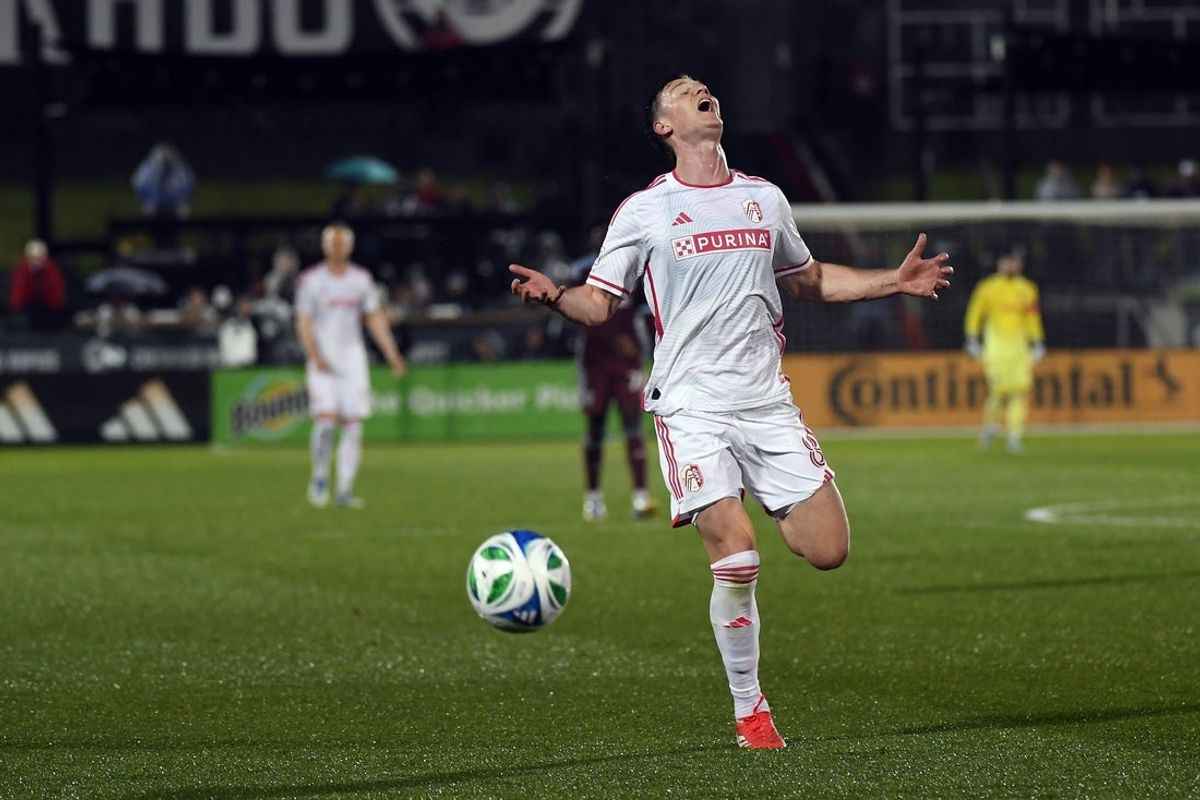 May 24, 2025; Commerce City, Colorado, USA; St. Louis City midfielder Chris Durkin (8) reacts as he is unable to chase down a loose ball during the second half against the Colorado Rapids at Dick's Sporting Goods Park. Mandatory Credit: Christopher Hanewinckel-Imagn Images