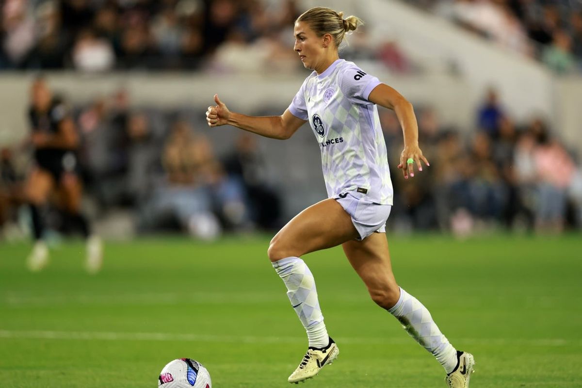 May 24, 2025; Los Angeles, California, USA;  Racing Louisville FC midfielder Kayla Fischer (9) dribbles the ball during the second half against Angel City FC at BMO Stadium. Mandatory Credit: Kiyoshi Mio-Imagn Images