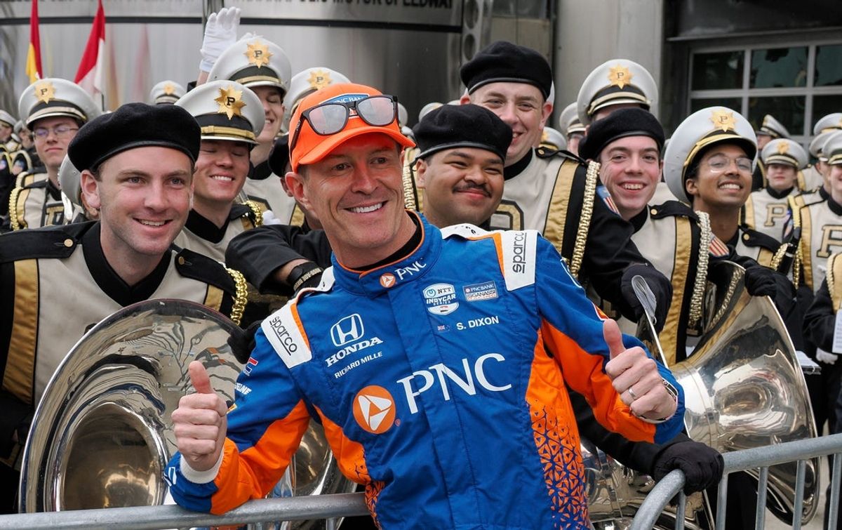 Chip Ganassi Racing driver Scott Dixon (9) poses for a photo with the Purdue All-American Marching Band Sunday, May 25, 2025, ahead of the 109th running of the Indianapolis 500 at Indianapolis Motor Speedway.