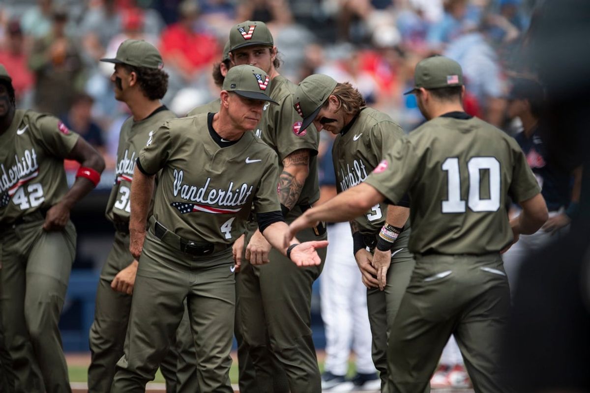Vanderbilt Commodores head coach Tim Corbin (4) shakes hands with his players during introductions as Ole Miss Rebels take on Vanderbilt Commodores during the SEC baseball tournament championship game at Hoover Met in Birmingham, Ala., on Sunday, May 25, 2025.