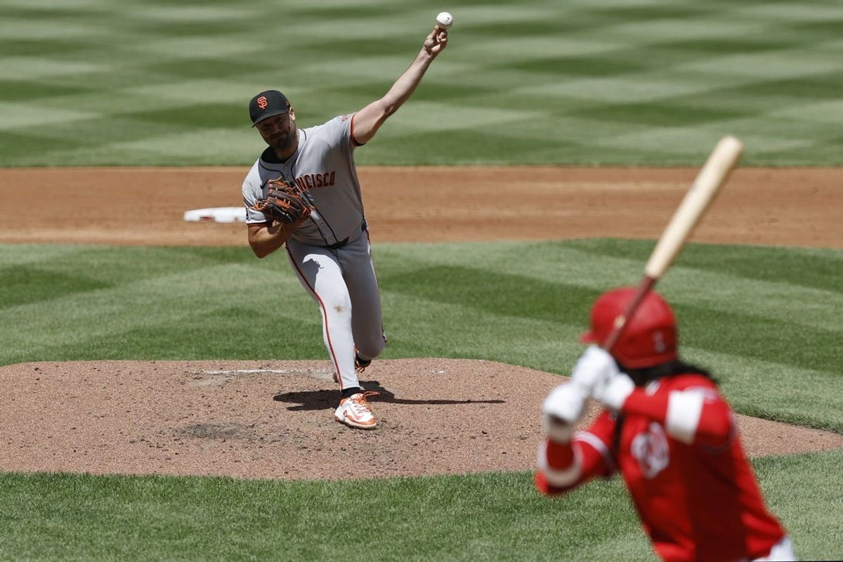 May 25, 2025; Washington, District of Columbia, USA; San Francisco Giants pitcher Robbie Ray (38) pitches against Washington Nationals shortstop CJ Abrams (5) during the third inning at Nationals Park. Mandatory Credit: Geoff Burke-Imagn Images