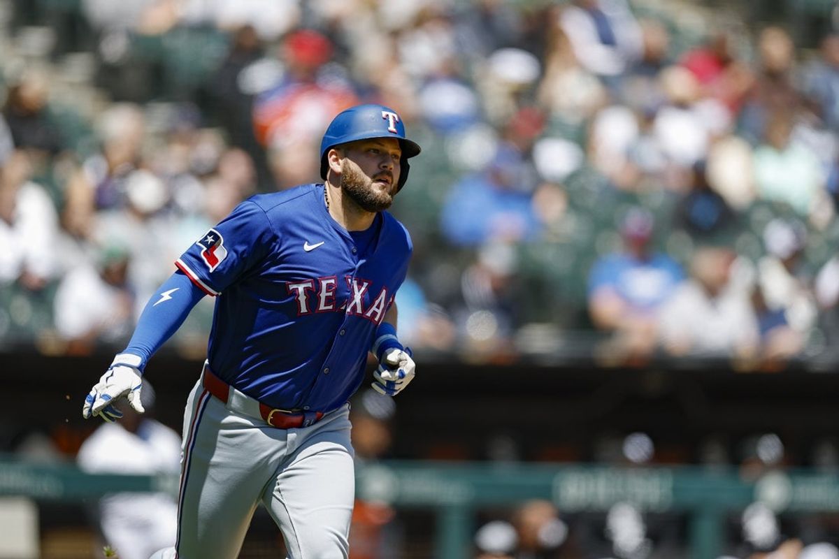 May 25, 2025; Chicago, Illinois, USA; Texas Rangers first baseman Jake Burger (21) rounds the bases after hitting a two-run home run against the Chicago White Sox during the second inning at Rate Field. Mandatory Credit: Kamil Krzaczynski-Imagn Images