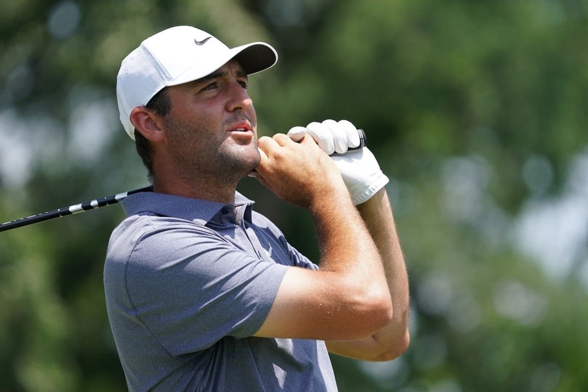 May 25, 2025; Fort Worth, Texas, USA; Scottie Scheffler watches his shot from the third tee during the final round of the Charles Schwab Challenge golf tournament. Mandatory Credit: Raymond Carlin III-Imagn Images