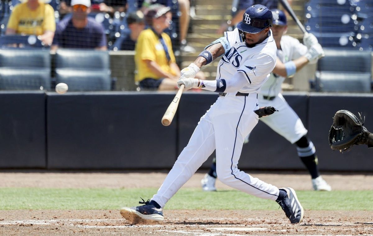 May 25, 2025; St. Petersburg, Florida, USA; Tampa Bay Rays outfielder Chandler Simpson (14) singles during the fourth inning against the Toronto Blue Jays at George M. Steinbrenner Field. Mandatory Credit: Kim Klement Neitzel-Imagn Images
