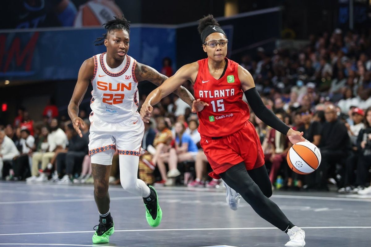 May 25, 2025; College Park, Georgia, USA; Atlanta Dream guard Allisha Gray (15) drives the ball towards the goal against Connecticut Sun guard Saniya Rivers (22) during the fourth quarter at Gateway Center Arena at College Park. Mandatory Credit: Jordan Godfree-Imagn Images